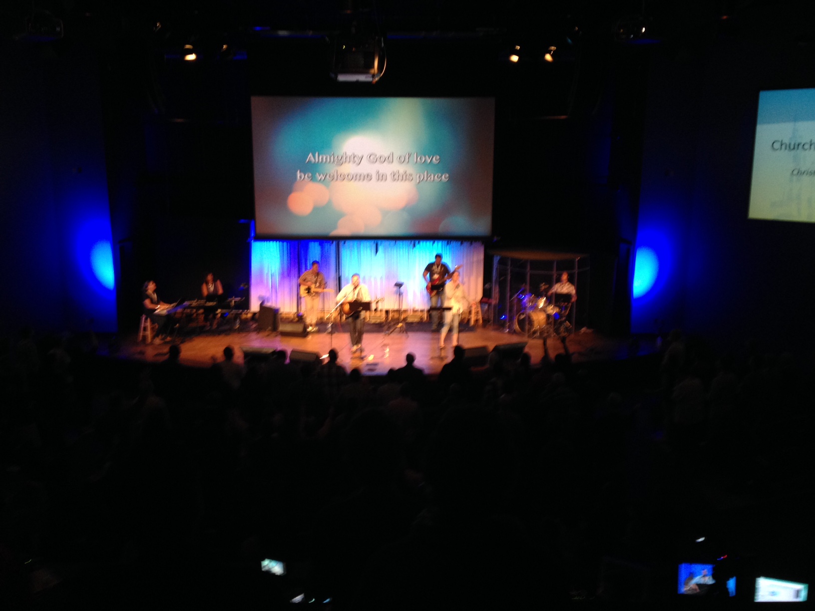 A blurry picture of the megachurch-style worship happening at the Church and Post-Christian Culture conference, a gathering of Anabaptist-minded folks and sponsored by Missio Alliance.