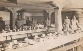 Brethren in Christ women prepare for a love feast during the 1911 General Conference in Highland, Ohio.